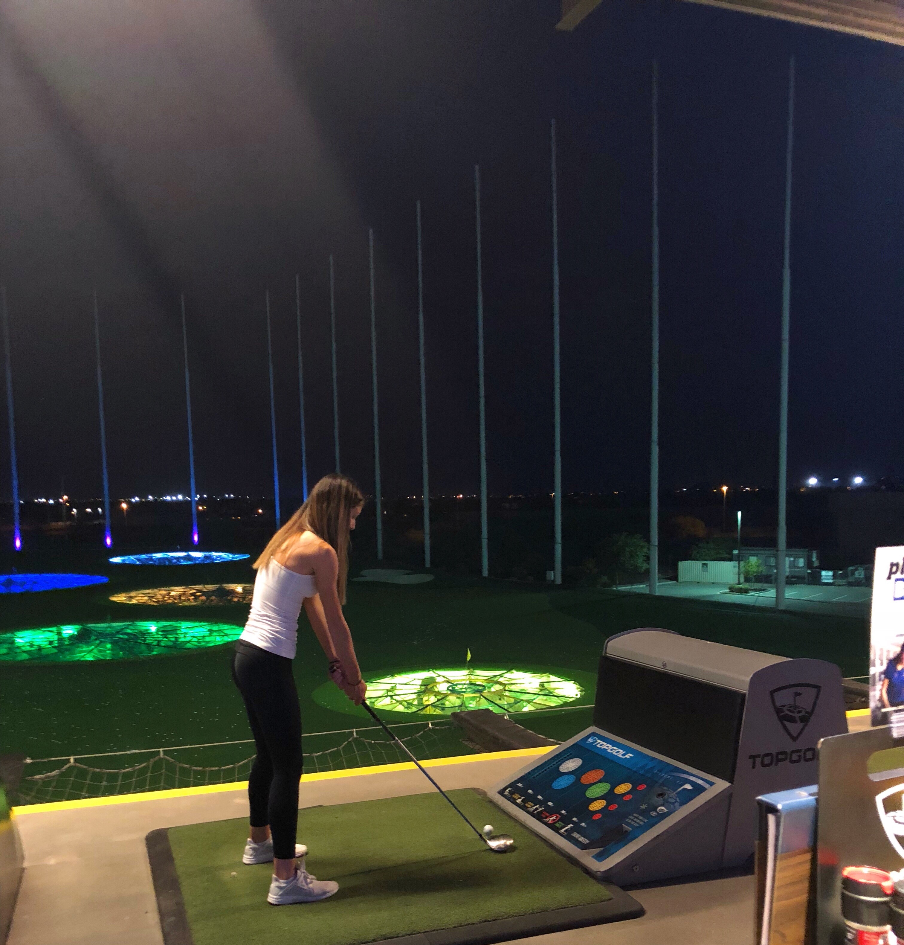 Demie golfing at Top Golf